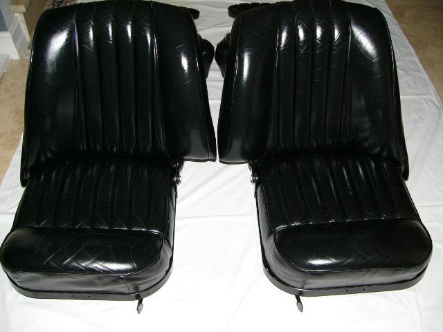 First class, black leather seats and jump seats from a 1959 jaguar xk150