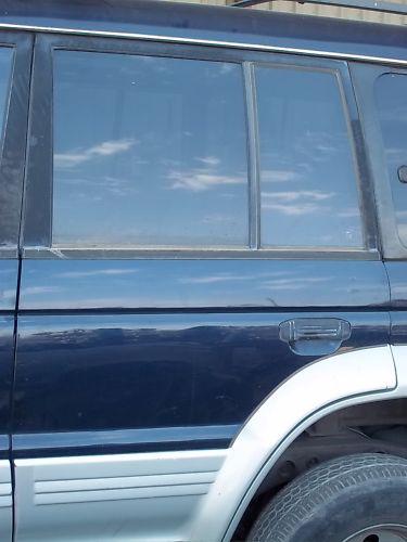 92-97 mitsubishi montero sr left driver side rear back power electric door