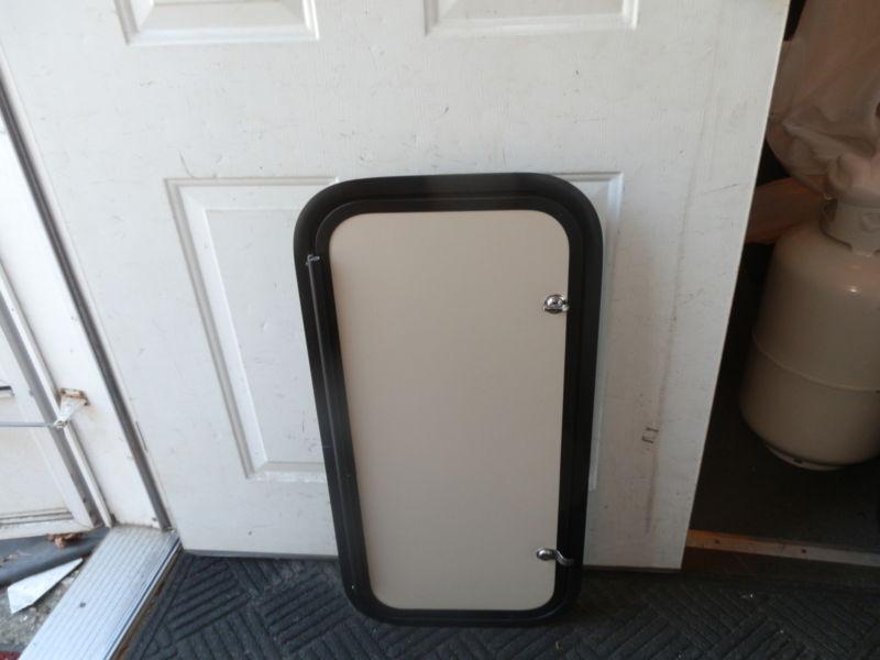Find RV CARGO DOOR R.O. 30" TALL X 14" WIDE X 2" THICK GREY/BLACK