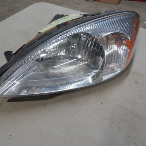 Driver left headlight without centennial package fits 00-07 taurus 17346