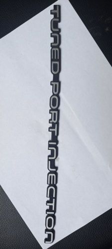 "tuned port injection", 82-92 rear bumper emblem, silver, vintage oem