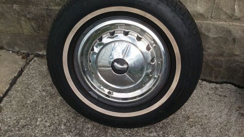 1957 chevy original wheel. good condition white wall tire. and hubcap nice .