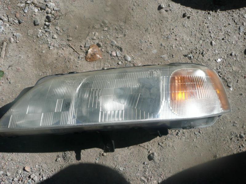 96  97  98 acura rl 3.5 drivers side headlight oem