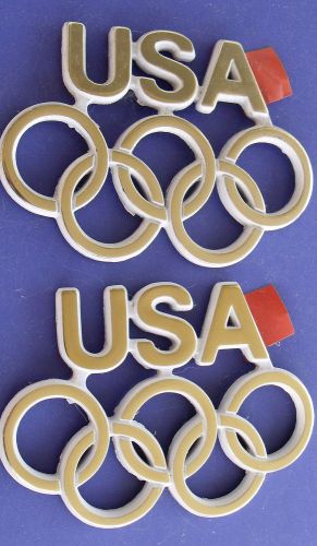 Buick regal olympic rings emblems pair gold/white new nos oem 84 badge usa