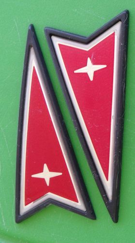 Pontiac arrow emblems lot oem badge grand am prix sunbird? reflective red/black