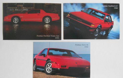 1986 lot of 3 original pontiac fiero sunbird &amp; firebird  advertising postcards