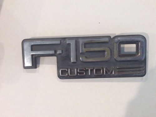 Ford fender emblem " f-150 custom"  ( one only)