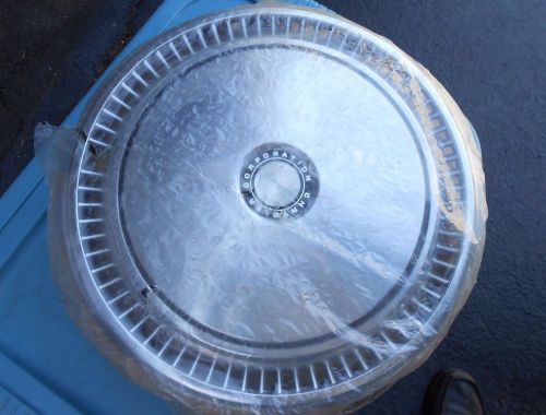 Set of 4 chrysler corporation hubcaps 15 inch nos