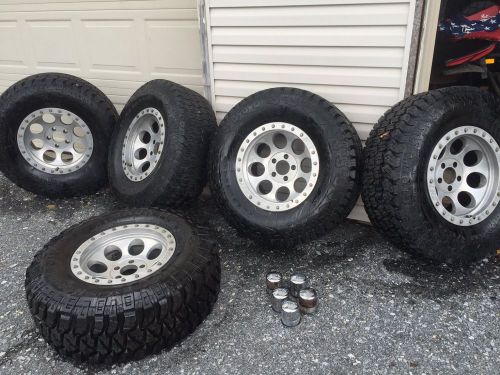Look! mickey thompson wheels and 35 inch oversized jeep wrangler/truck tires!