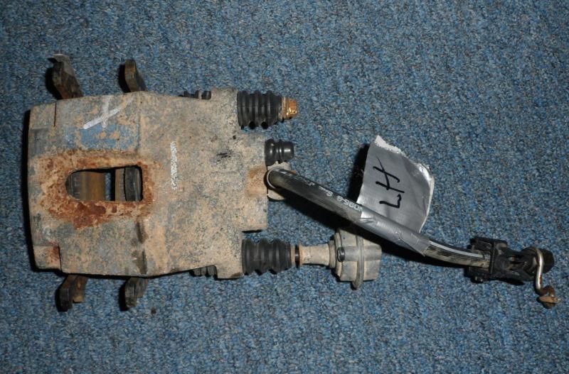 Left disc brake caliper w/ flex hose and brake pads - motorcraft