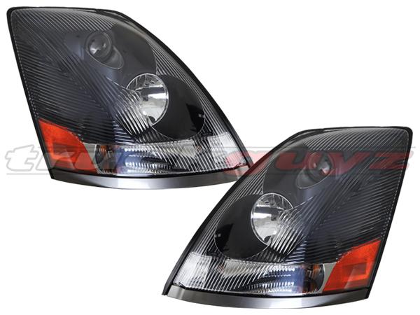 04-12 volvo vn vnl vnm series 430 630 670 730 780 head light black housing pair