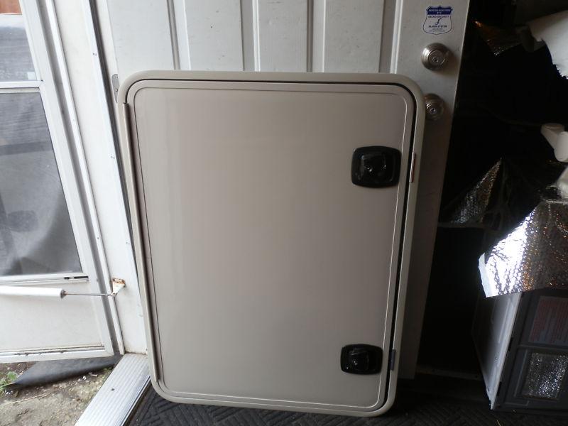 Rv cargo door r.o. 42" tall x 31" wide x 2" thick color: tan ( used )