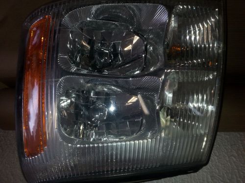 Cadillac escalade  headlight gm oem left gm part #15044521