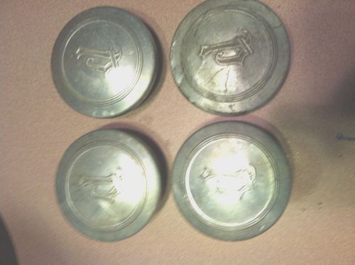 +++ a set of 4 plymouth grease caps -- bam!!