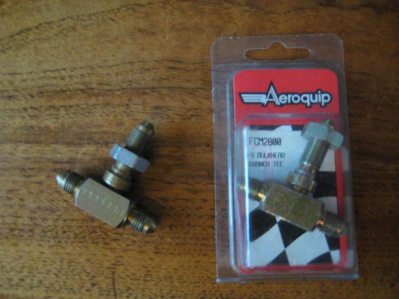 A pair of aeroquip fcm2800 / fbm2800 an -3 bulkhead t fitting
