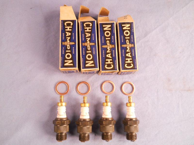 4 champion # 7 spark plugs nos never installed with boxes 18mm  1" hex 