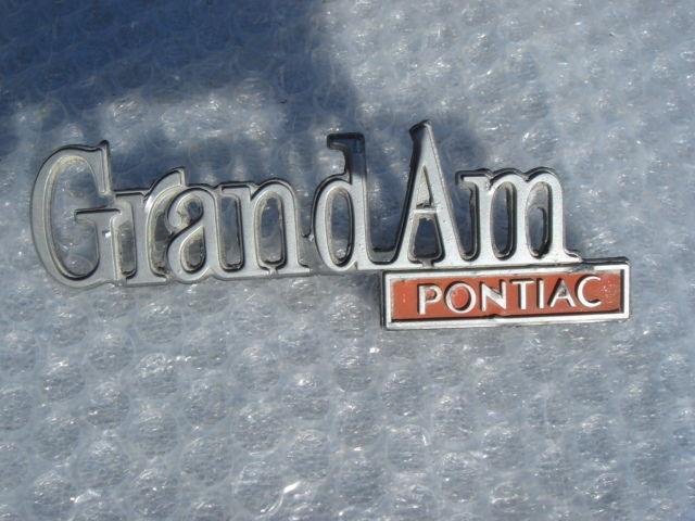 73 74 75 1975 pontiac " grand am pontiac" trunk emblem gm part # 9657700 rare