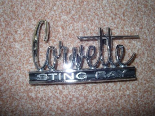 1967 corvette rear deck emblem ( survivor)  / 1966 corvette front hood emblem