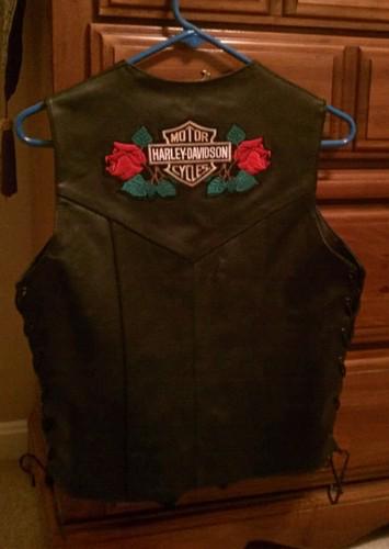 Ladies black leather vest..size medium