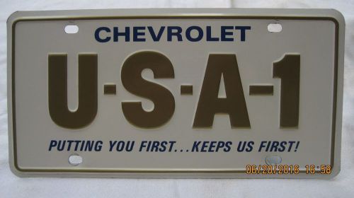 Usa-1 original mint license plate  chevrolet putting you first keeps us first